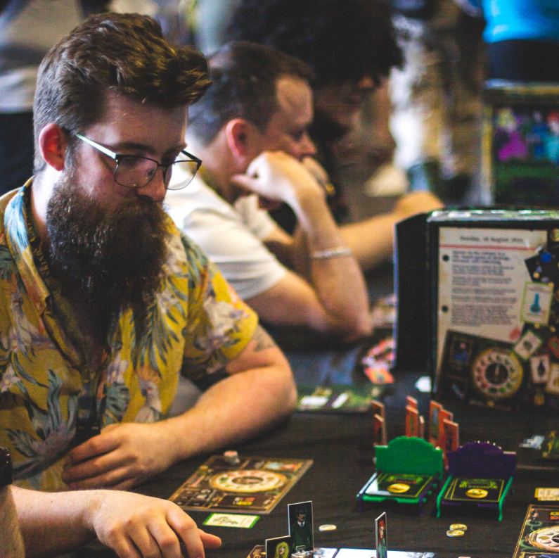 Experienced players in a public demo of Horror in the Library, cropped to emphasise the deeper advanced play atmosphere
